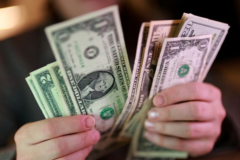 Dollar holds near two-week high ahead of Fed decision