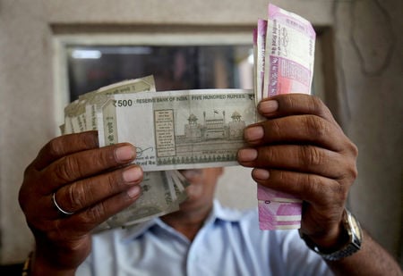 Asia FX steady as dollar holds near 18-mth high; rupee jumps on RBI measures
